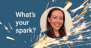 Blue background with image of orange sparks flying and the words "What's your spark?" next to a photo of the employee.